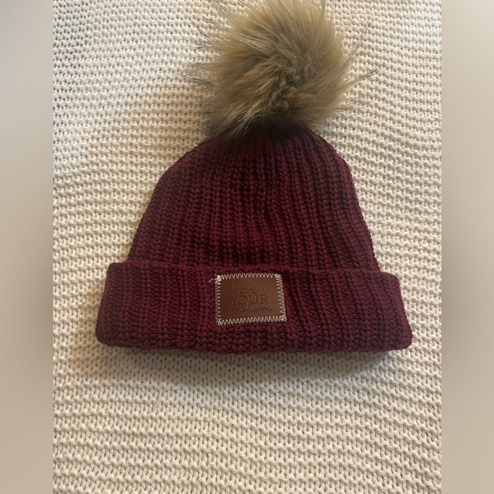Woman’s maroon love your Mellon knit winter hat